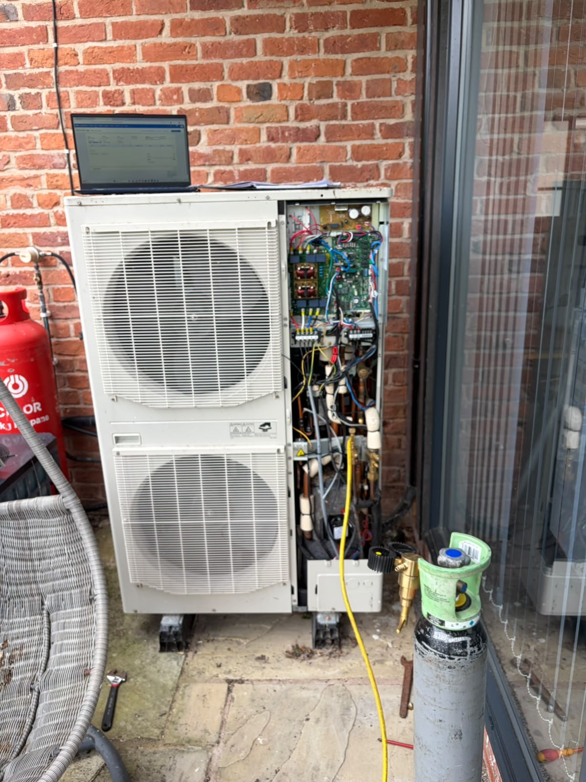 Air conditioning repair and fault diagnosis on a condenser unit by Gear Bros Ltd